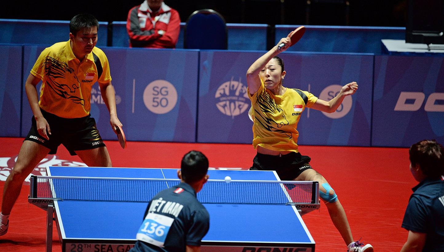 Singapore's Yu Mengyu and Yang Zi ( left ) playing against Vietnam in the semi final of the mixed doubles.&nbsp;-- ST PHOTO: DESMOND FOO&nbsp;