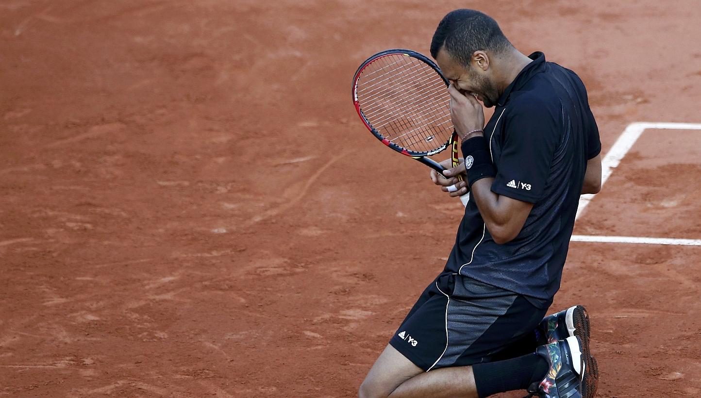 Jo-Wilfried Tsonga of France celebrates after defeating Kei Nishikori of Japan during their men's quarter-final match during the French Open tennis tournament at the Roland Garros stadium in Paris. PHOTO: REUTERS
