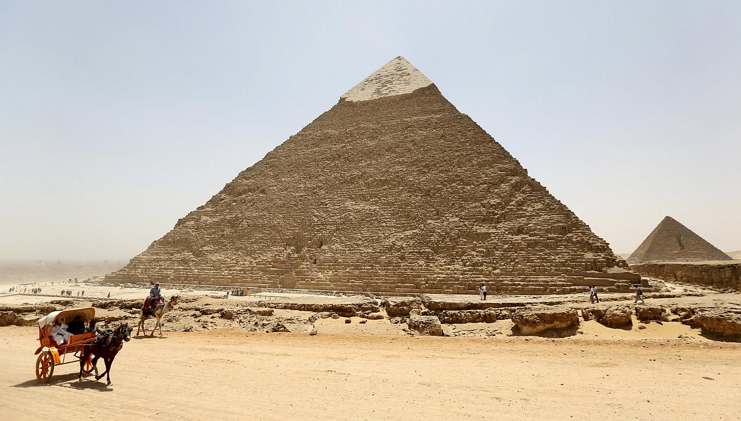 Gunmen on a motorbike Wednesday killed two Egyptian policemen who worked as guards at the world-famous Giza pyramids in Cairo, in the latest attack on security forces, police said. -- PHOTO: REUTERS&nbsp;