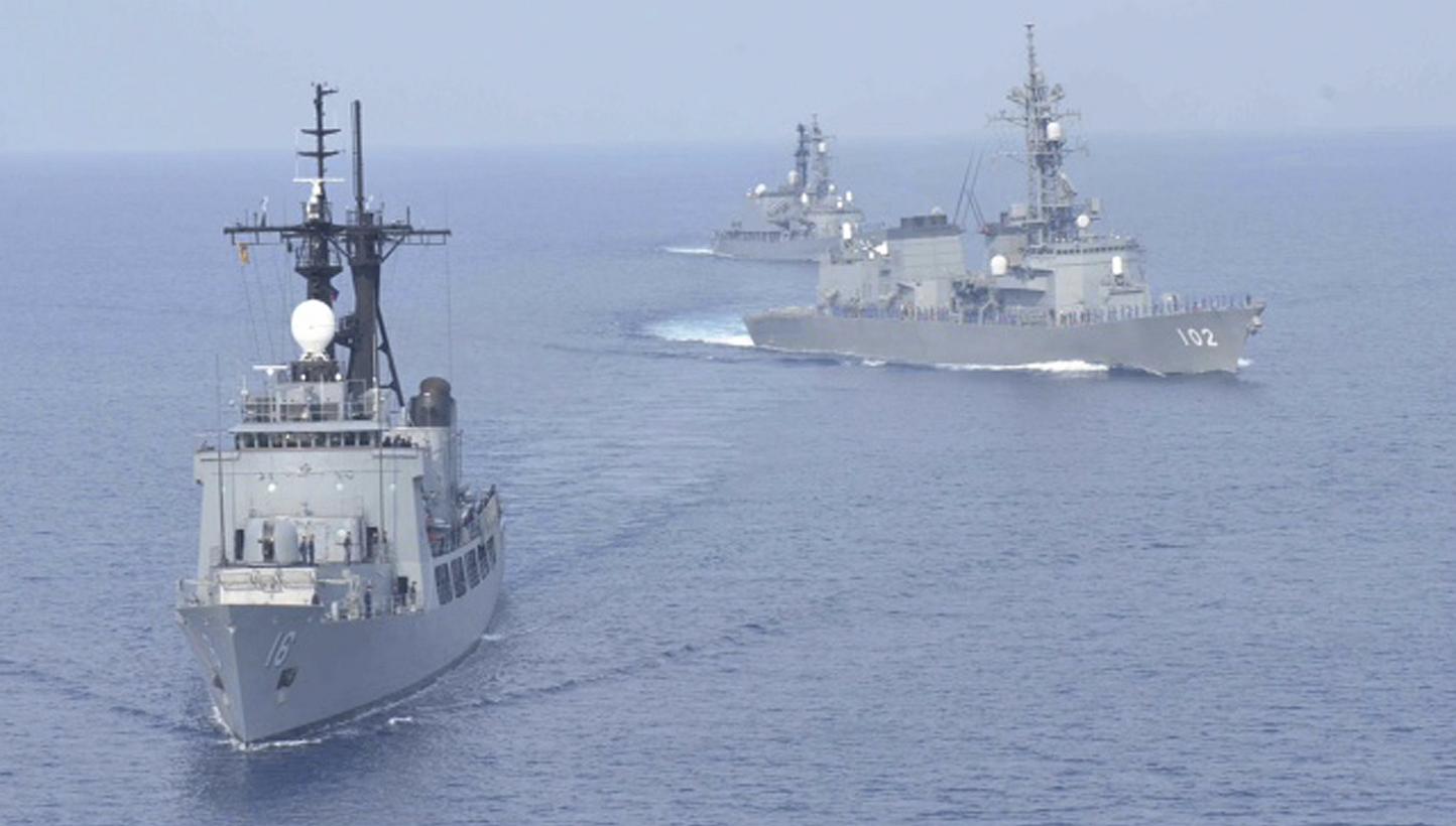 Japanese Maritime Self-Defence Force destroyers Harusame (right) and Amagiri (background) sail near Philippine warship BRP Ramon Alcaraz (foreground) during a joint naval drill in South China Sea on May 12, 2015. Japan and the Philippines were set to