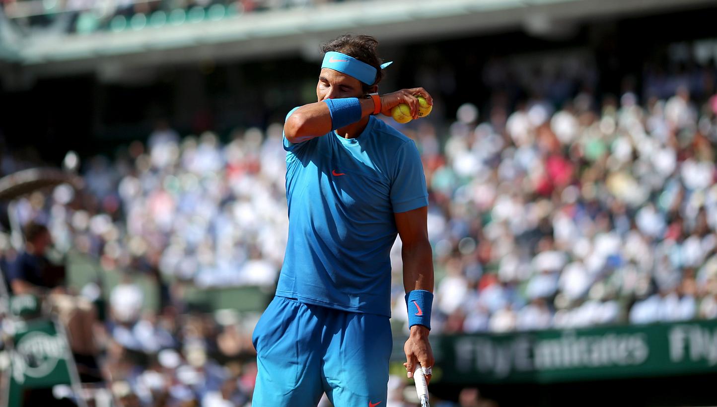 Rafael Nadal of Spain in action against Novak Djokovic of Serbia during their quarterfinal match for the French Open tennis tournament at Roland Garros in Paris, France, on June 3, 2015. -- PHOTO: EPA