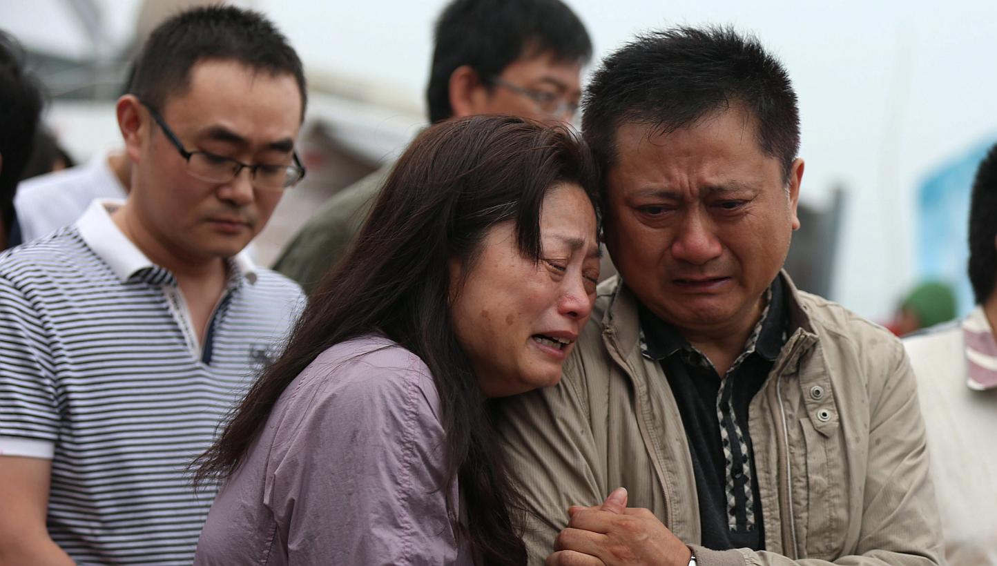 Relatives of passengers missing in the sinking of a cruise ship on the Yangtze River have accused Chinese police of beating them when they sought more information on the disaster. -- PHOTO: EPA&nbsp;