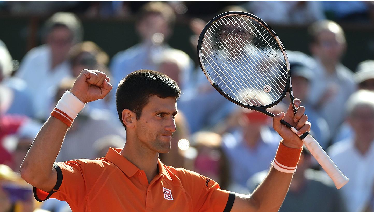 Serbia's Novak Djokovic celebrates his victory over Spain's Rafael Nadal at the end of their men's quarter final match of the Roland Garros 2015 French Tennis Open in Paris on June 3, 2015. -- PHOTO: AFP &nbsp;