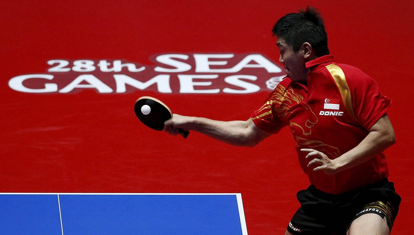 Singapore's Gao Ning hits a return to Richard Gonzales of the Philippines during their men's singles table tennis finals match at the Southeast Asian (SEA) Games in Singapore on June 4, 2015. -- PHOTO: REUTERS