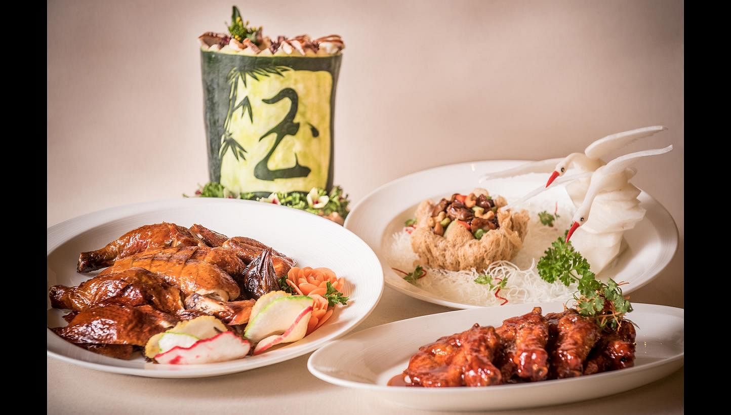 The new menu includes (clockwise from left) roast chicken, double-boiled winter melon soup, Kung Pao Chicken with Cashew Nuts served in Buddha's Bowl and Pork King Ribs.