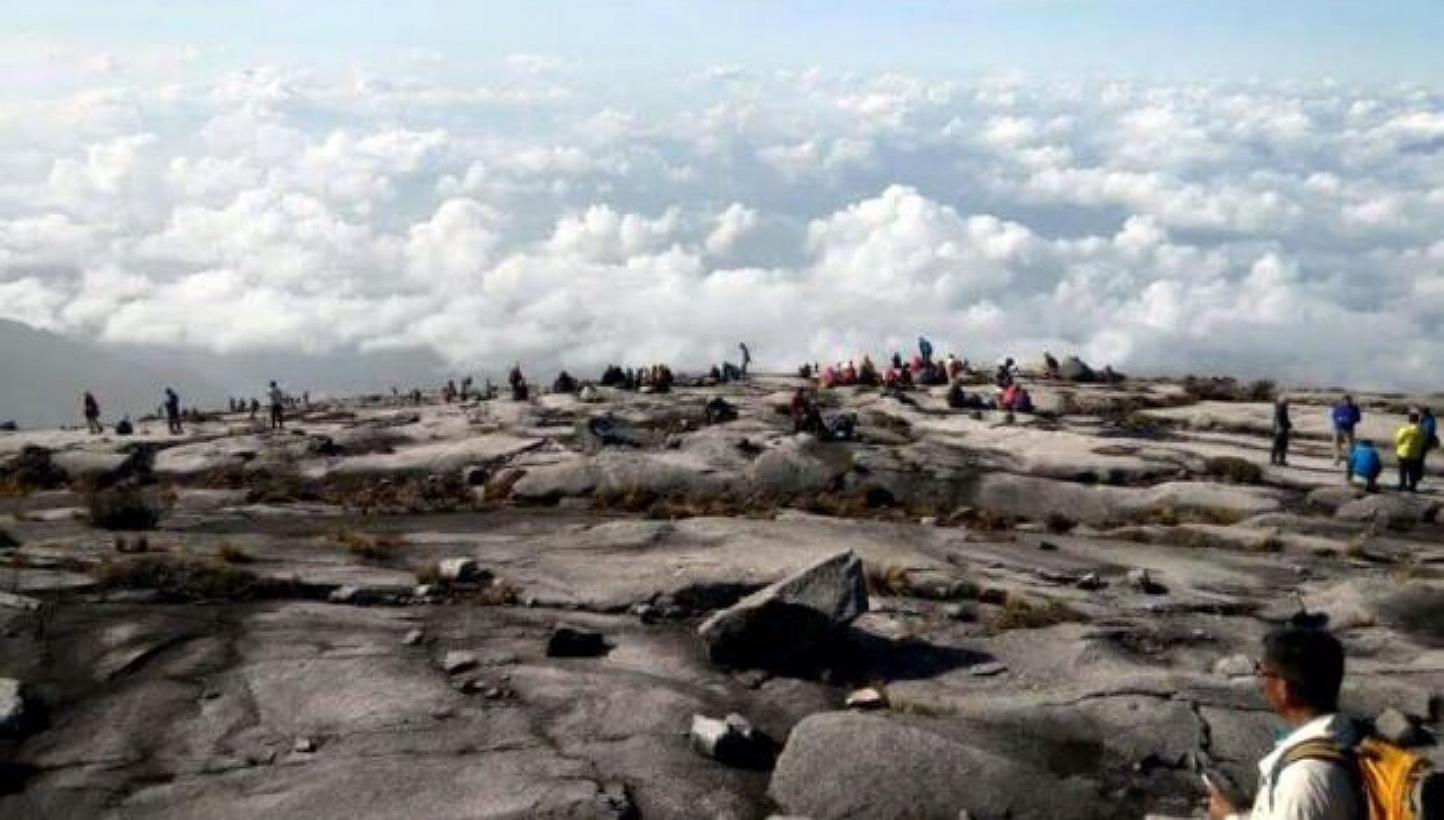 Climbers at the peak of Mount Kinabalu. -- PHOTO: COURTESY OF BOMBA MALAYSIA/ THE STAR/ ASIA NEWS NETWORK&nbsp;