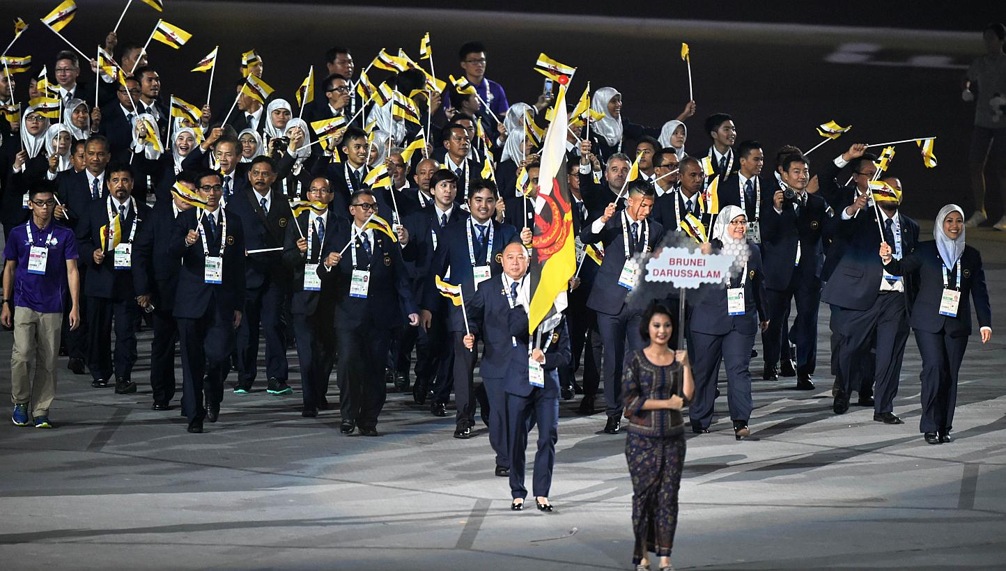Athletes from Brunei marching into the National Stadium during the SEA Games opening ceremony on June 5, 2015. -- PHOTO: AFP 