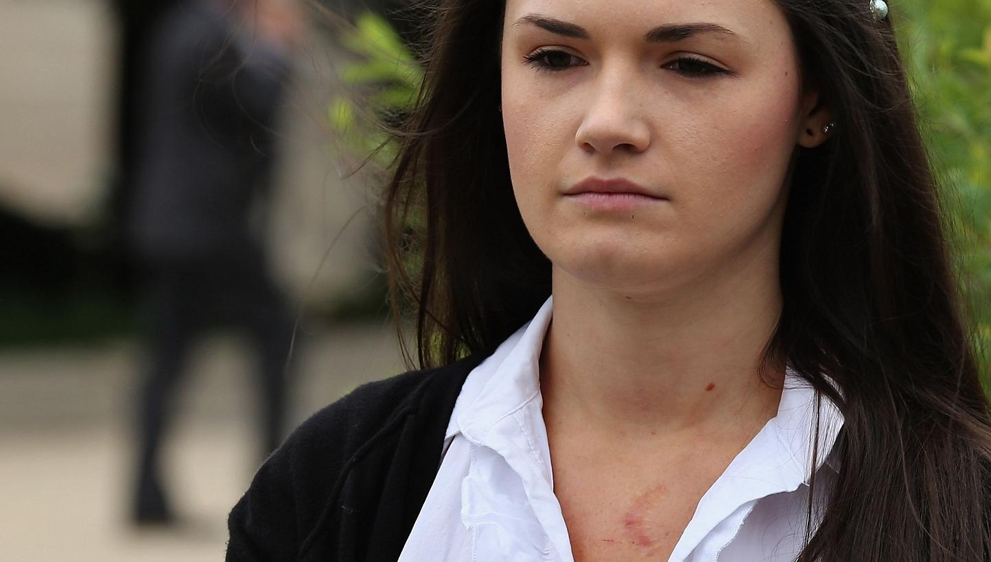 Angelina Sujata, with a scar on her chest where she was injured three years ago by a defective Takata airbag, joins members of Congress for a news conference outside the US Capitol on Tuesday (June 2) in Washington, DC. Sujata was driving a 2001 Hond