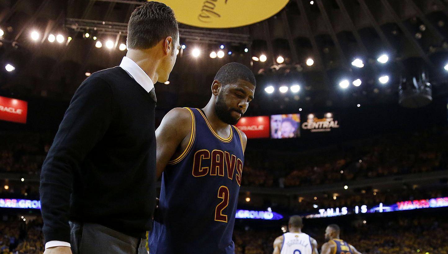 Cleveland Cavaliers point guard Kyrie Irving leaves the court after an injury during the game against the Golden State Warriors in Oakland, California, on Friday, June 5, 2015. Irving will miss the rest of the championship series against the Warriors