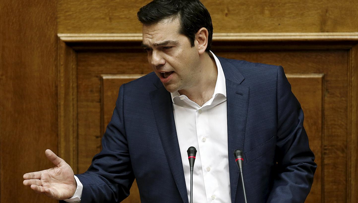 Greek Prime Minister Alexis Tsipras delivers a speech during a parliamentary session to brief lawmakers over the ongoing talks with the country's lenders, in Athens, Greece, on June 5, 2015. The Greek PM said that the country was "closer than ever to