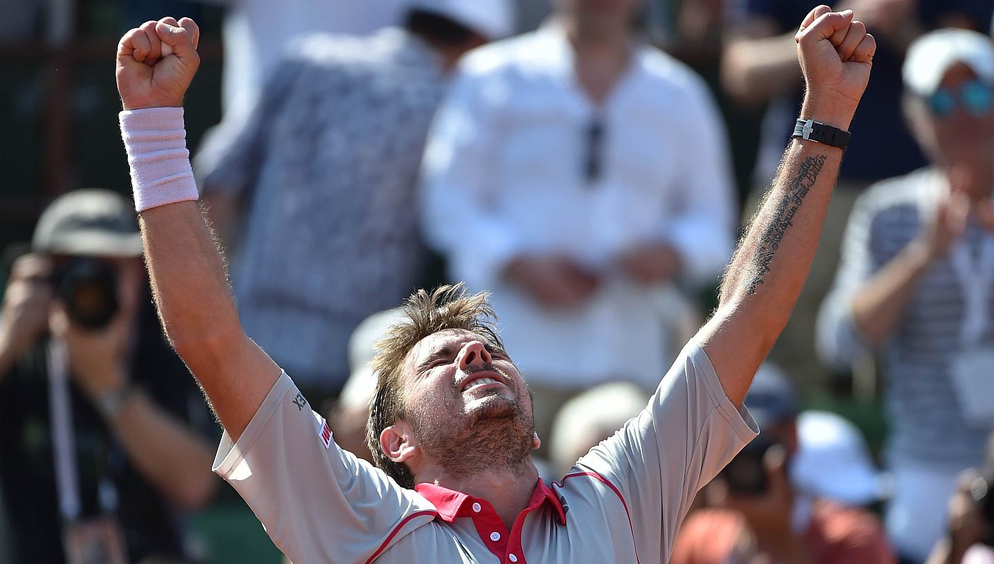Switzerland's Stanislas Wawrinka celebrates after winning his match against France's Jo-Wilfried Tsonga during their men's semi-final match of the Roland Garros 2015 French Tennis Open in Paris on June 5, 2015. -- PHOTO: AFP