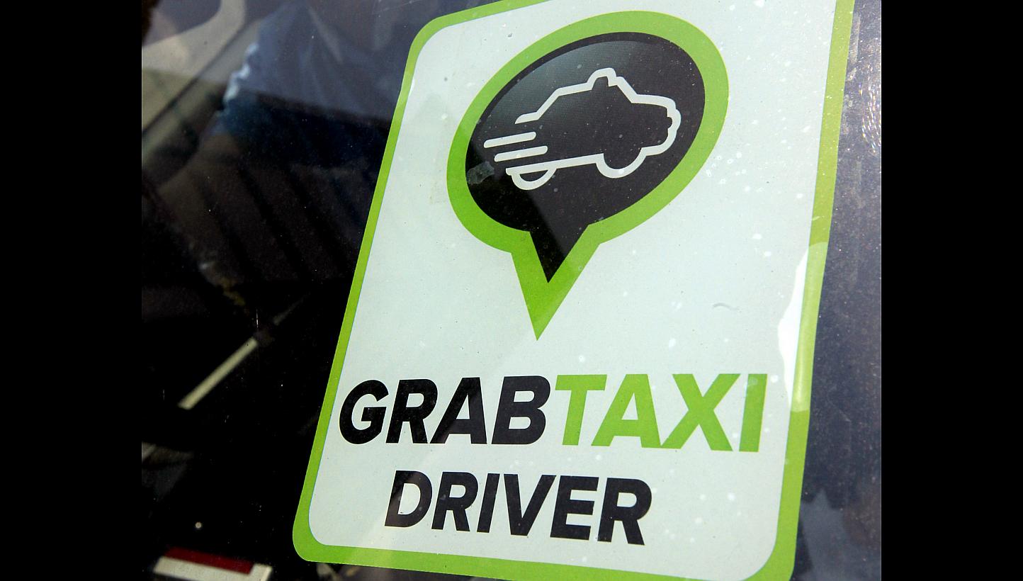 Transport app provider GrabTaxi is tying up with a rental company to grow a fleet of on-call taxis.&nbsp;-- PHOTO: ST FILE