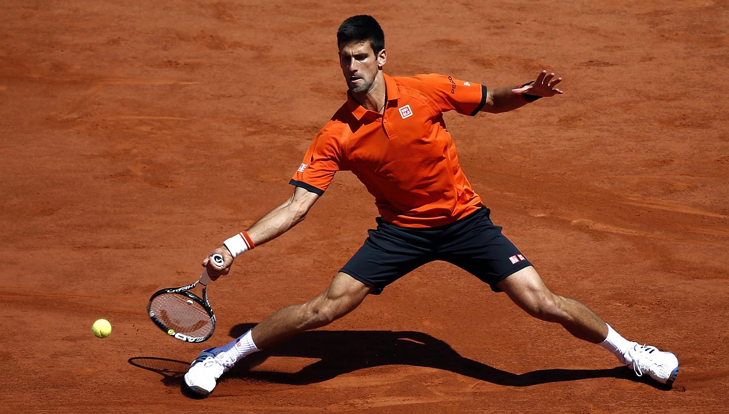 Novak Djokovic of Serbia in action against Andy Murray of Britain during their semifinal match for the French Open tennis tournament at Roland Garros in Paris, France on June 6, 2015. -- PHOTO: EPA