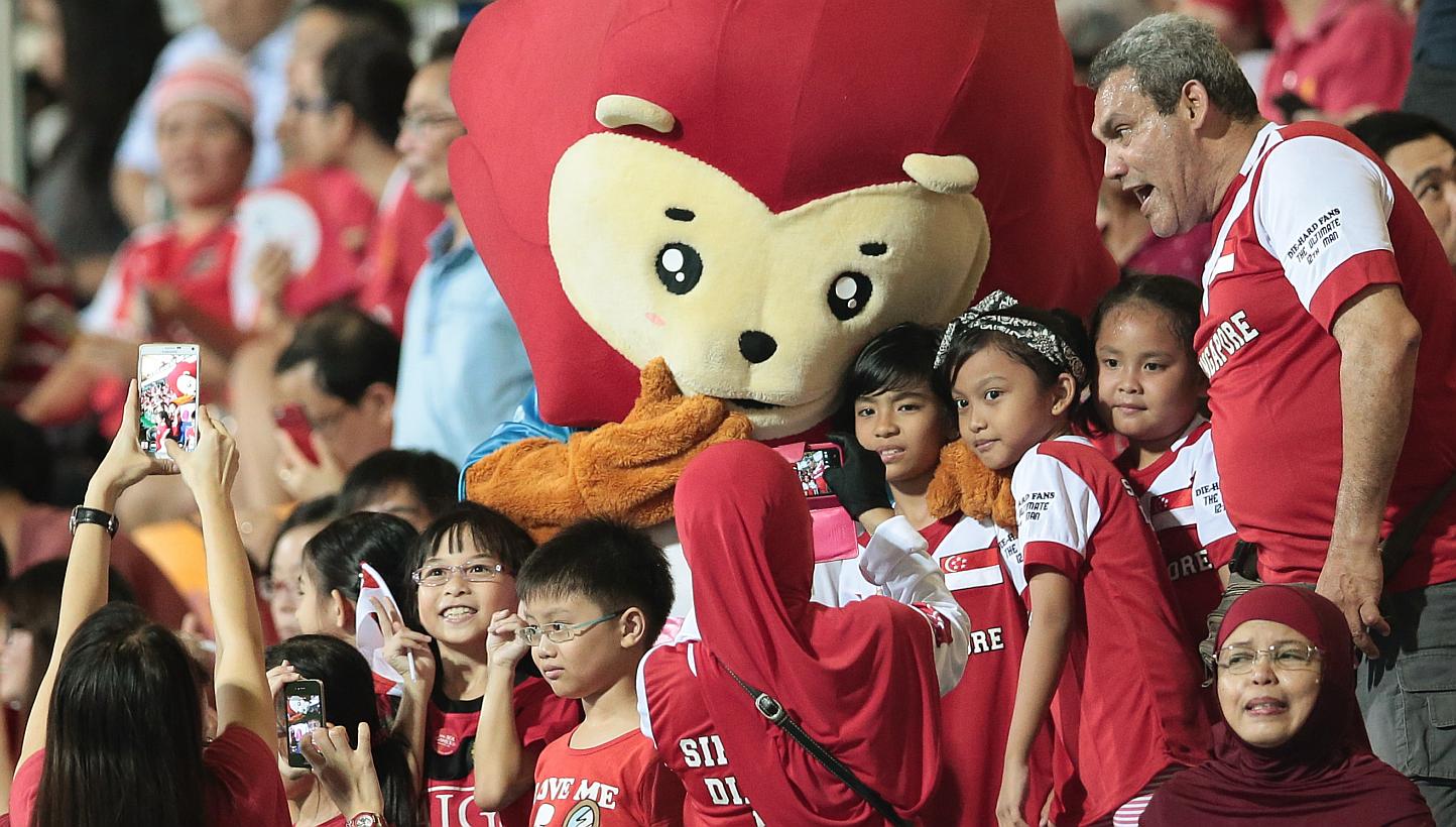 SEA Games mascot Nila posing with fans during the football match between Singapore and Philippines at the Jalan Besar Stadium on June 1, 2015. -- PHOTO: REUTERS