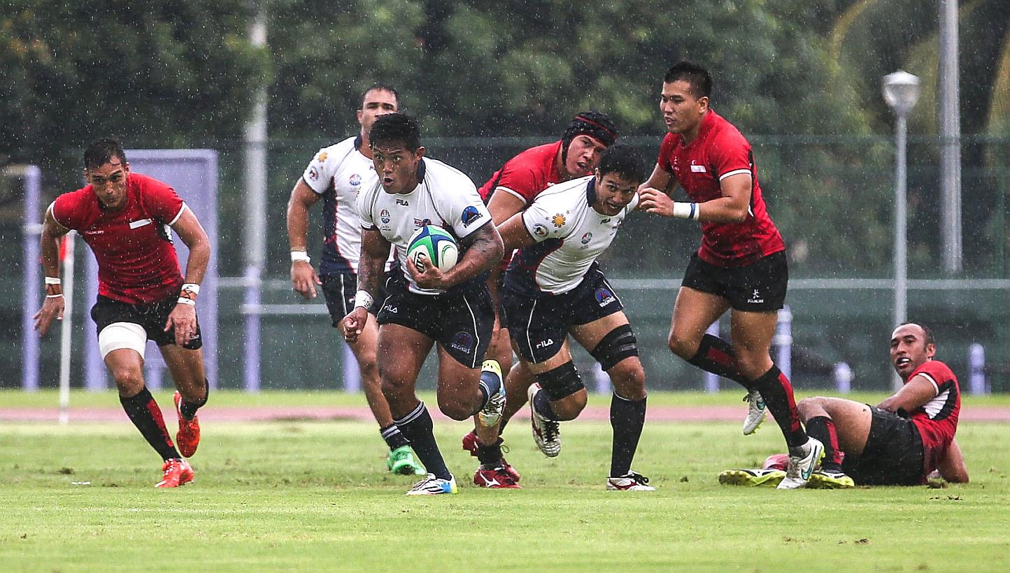 Singapore's men's rugby team in action at the Choa Chu Kang Stadium on June 6, 2015. -- PHOTO: THE NEW PAPER 