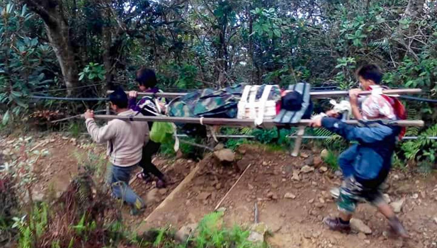 A photo taken by a mountain guide, showing other guides carrying an injured climber down. It was tweeted by Sabah's Tourism, Culture and Environment Minister Datuk Seri Masidi Manjun. -- PHOTO: MASIDI MANJUN/TWITTER