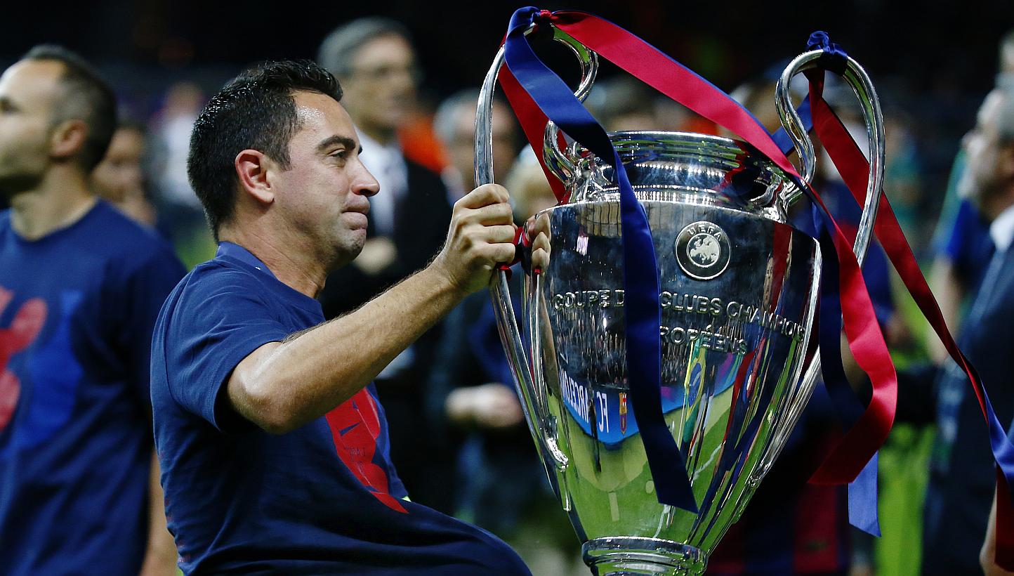 Barcelona's Xavi celebrates with the Champions League trophy after winning the UEFA Champions League Final between FC Barcelona and Juventus at the Olympiastadion, in Berlin, Germany, on June 6, 2015. -- PHOTO: REUTERS&nbsp;