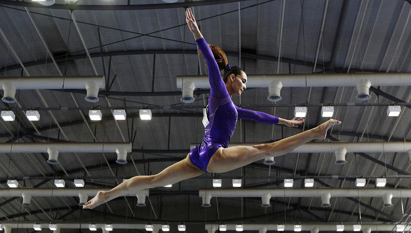 Malaysia's Farah Ann Abdul Hadi performing on the balance beam during the women's artistic gymnastics team final at the 28th SEA Games in Singapore on June 7, 2015. -- PHOTO: REUTERS