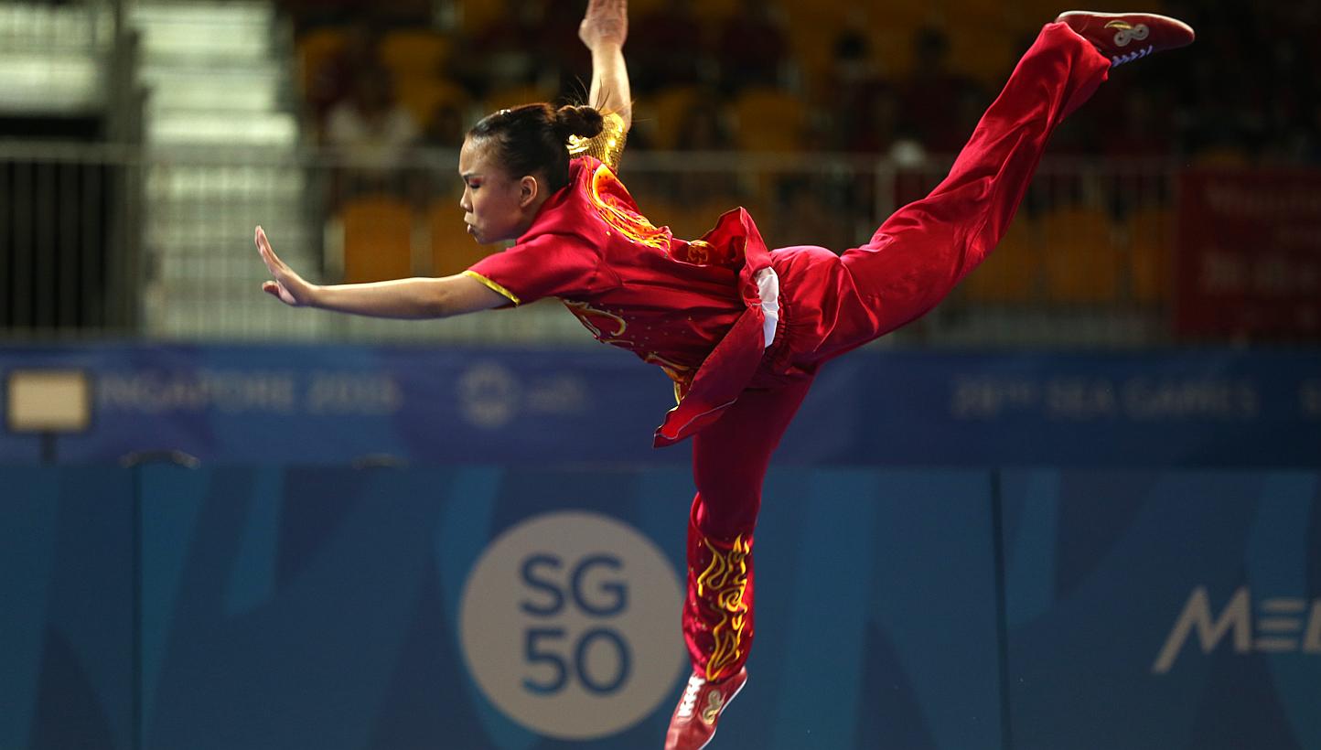 Singapore's Zoe Mui clinched the gold in the women's changquan (optional) event held at the Singapore Expo on June 7, 2015. -- ST PHOTO: SEAH KWANG PENG