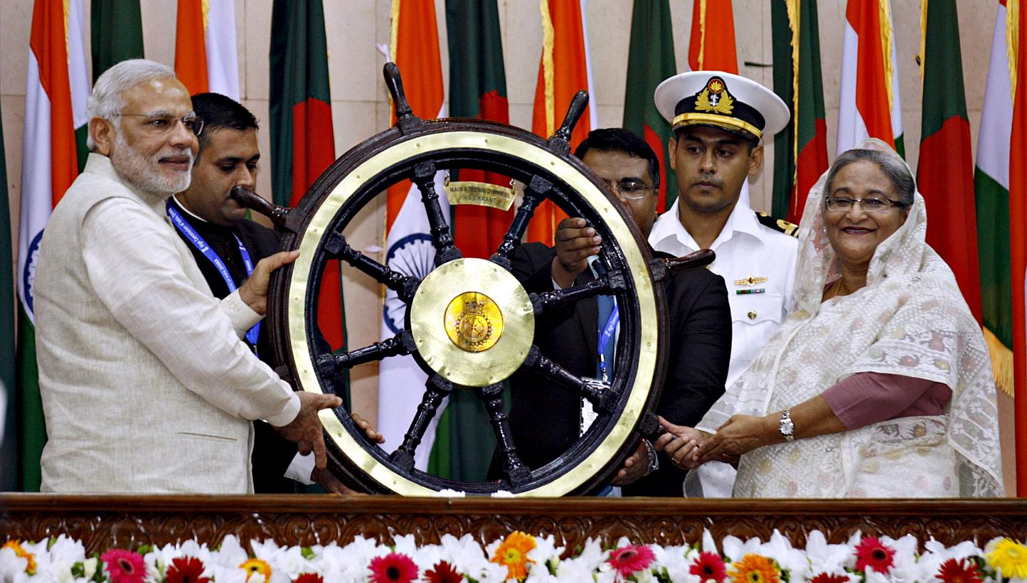 India's Prime Minister Narendra Modi (left) presents a ship's wheel to Bangladesh's Prime Minister Sheikh Hasina (right) in Dhaka on June 6, 2015. -- PHOTO: REUTERS