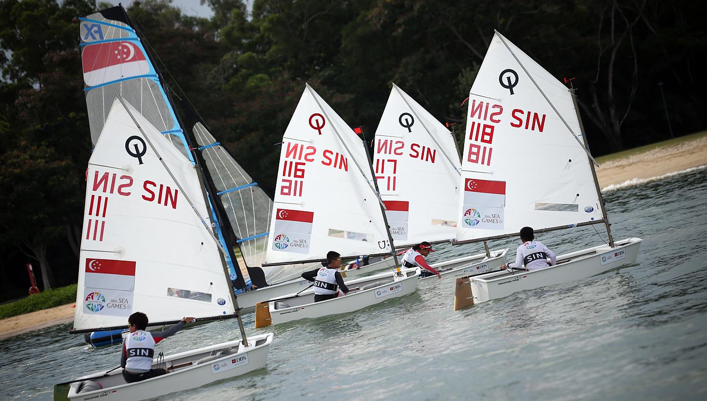 Singapore's optimist sailors had to settle for a SEA Games silver in the team event on Sunday afternoon, after they lost 2-0 to Malaysia in a best-of-three match race final. -- PHOTO: ZAO BAO