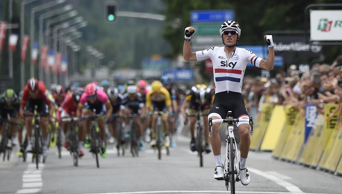 Great Britain's Peter Kennaugh celebrates as he crosses the finish line at the end of the 131.5 km first stage of the 67th edition of the Dauphine Criterium cycling race on Sunday (June 7) between Ugine and Albertville in the French Alps. -- PHOTO AF