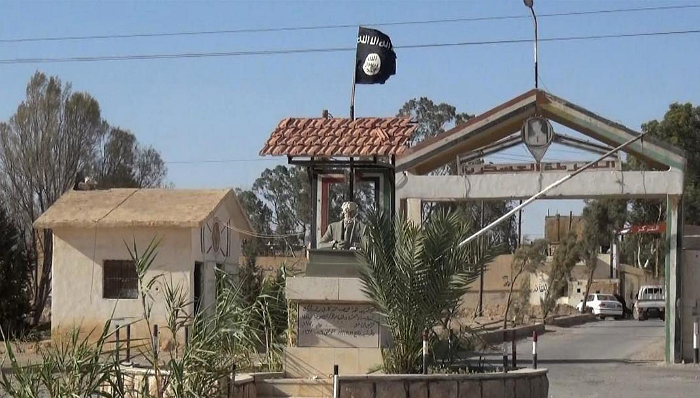 The Islamic State in Iraq and Syria (ISIS) militant group launched a sweeping offensive a year ago that overran large chunks of Iraqi territory, led to thousands of deaths and displaced millions of people. -- PHOTO: AFP