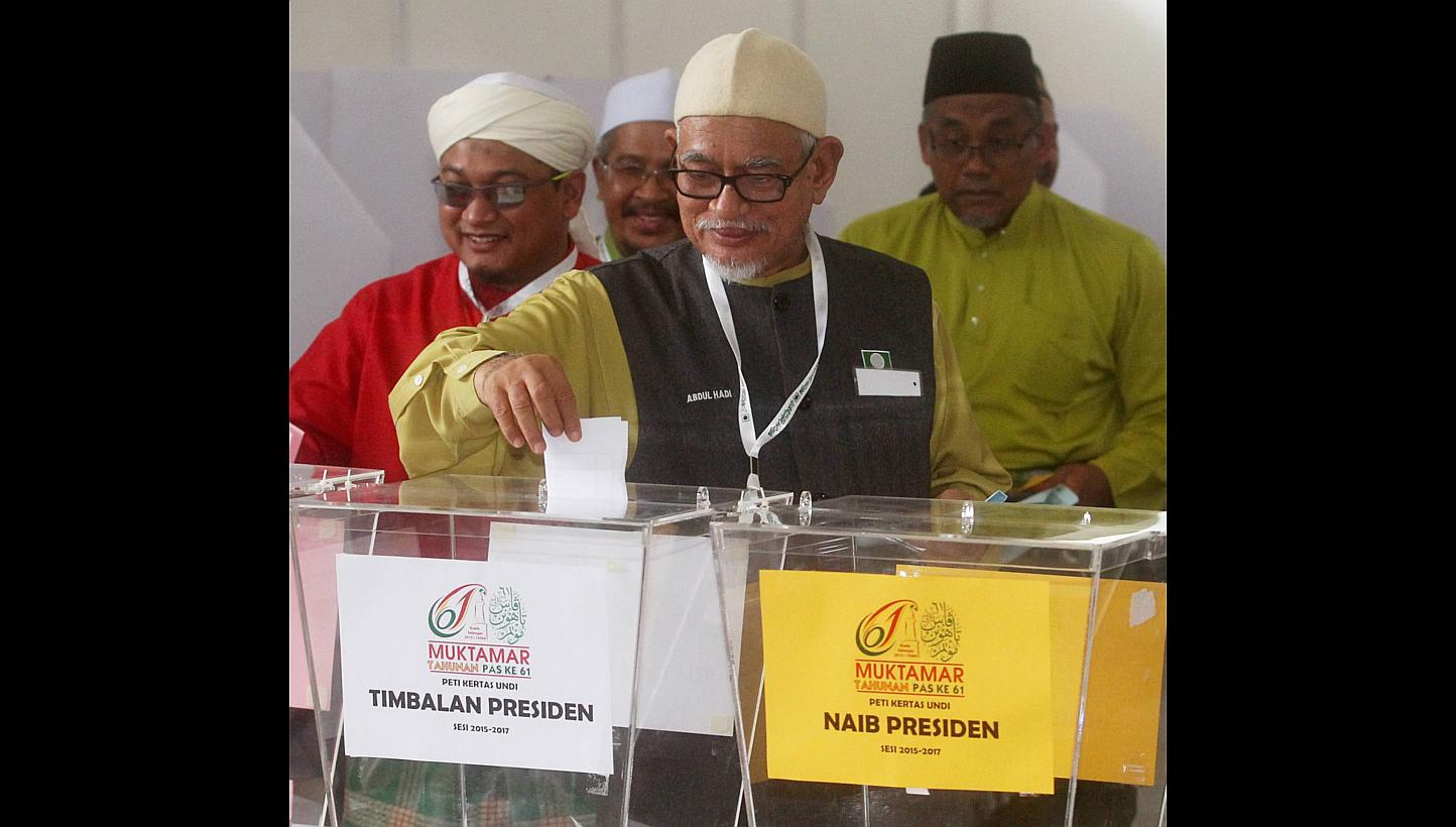 Parti Islam SeMalaysia president Abdul Hadi Awang casting his vote at the party elections last week. The pro-ulama group outvoted the professionals and won almost all the seats in the main executive committee while expanding their dominance to the yo