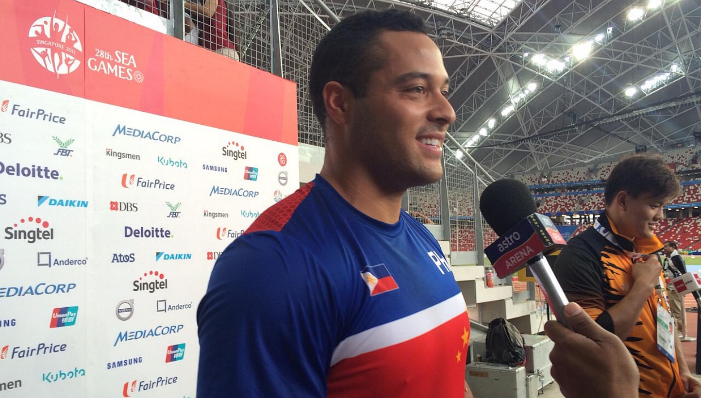 Filipino Caleb John Christian Stuart being interviewed after winning the gold in the SEA Games hammer throw event on June 9, 2015. He also set a new Games record of 65.63m. -- ST PHOTO: CHUAN LIMIN 