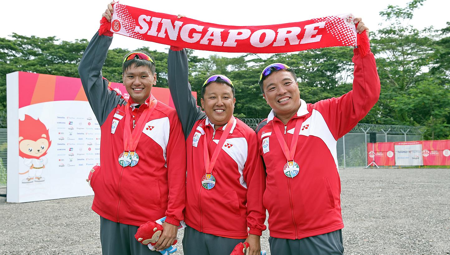 Singapore's men's skeet team silver medallists (from left) Low Jiang Hao, Eugene Chiew and David Chan at the National Shooting Centre on June 9, 2015. -- ST PHOTO: SEAH KWANG PENG