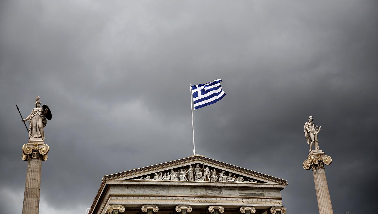 Statues of the Greek goddess Athena (left) and god Apollo flank Greece's national flag atop the Athens Academy. Greece has made clear its willingness to engage in continued reforms. A dose of reality on the part of Greece's creditors - about what is
