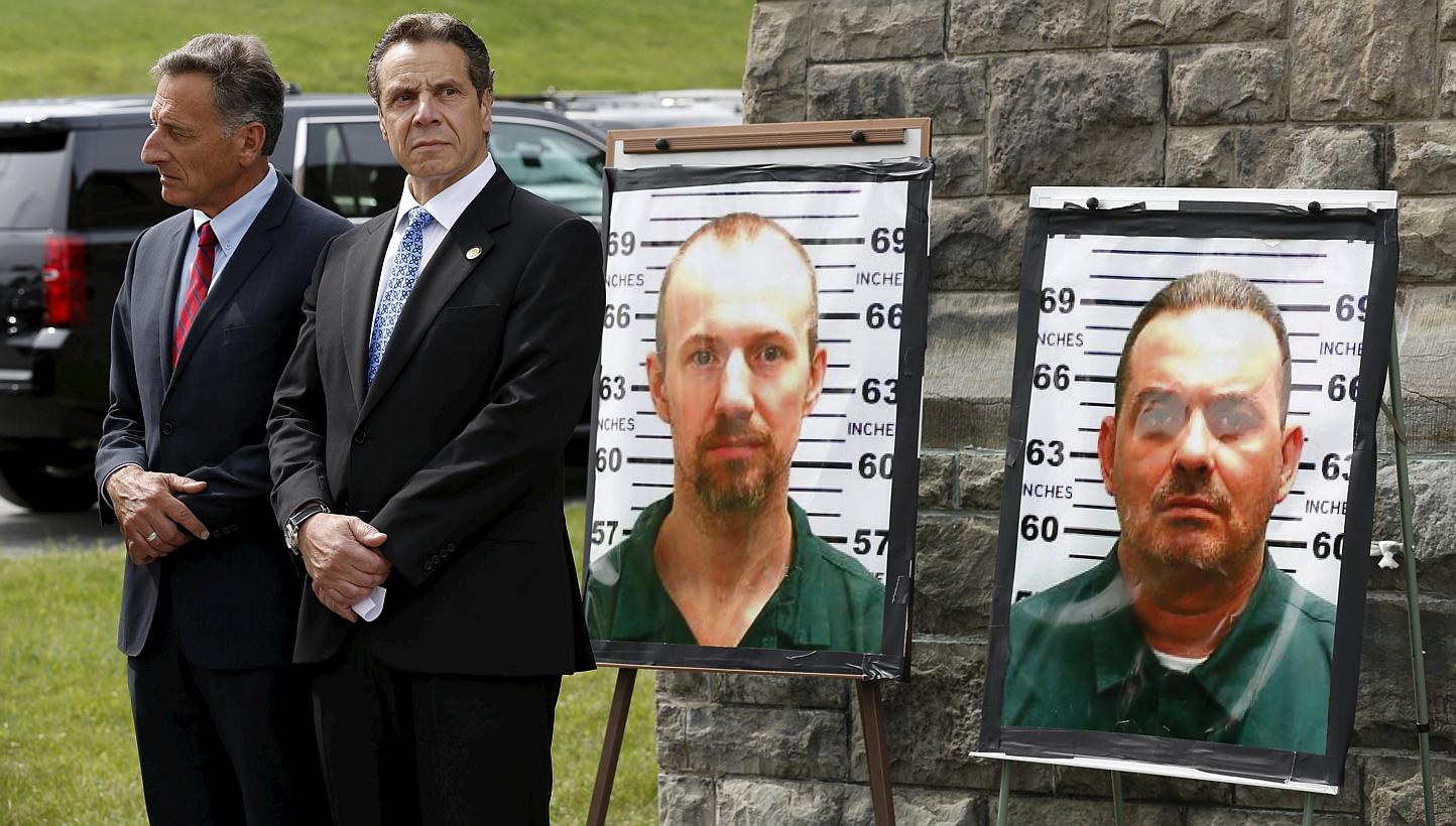 Vermont Governor Peter Shumlin (left) and New York Governor Andrew Cuomo take part in a news conference at the Clinton Correctional Facility in Dannemora, New York on June 10, 2015. The manhunt for the two convicts who escaped from Clinton Correction