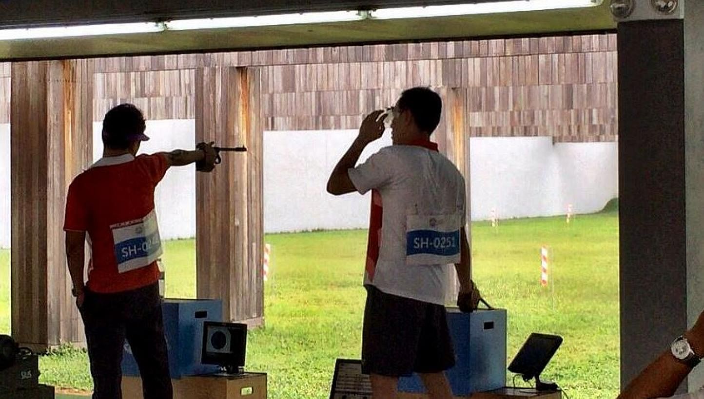 Host Singapore's 50m pistol team of Gai Bin, Nigel Lim and Poh Lip Meng struck their first gold at this SEA Games, combining to register 1,632 points, ahead of Vietnam (1,626) and Malaysia (1,615). -- PHOTO: ST SPORTS DESK/TWITTER