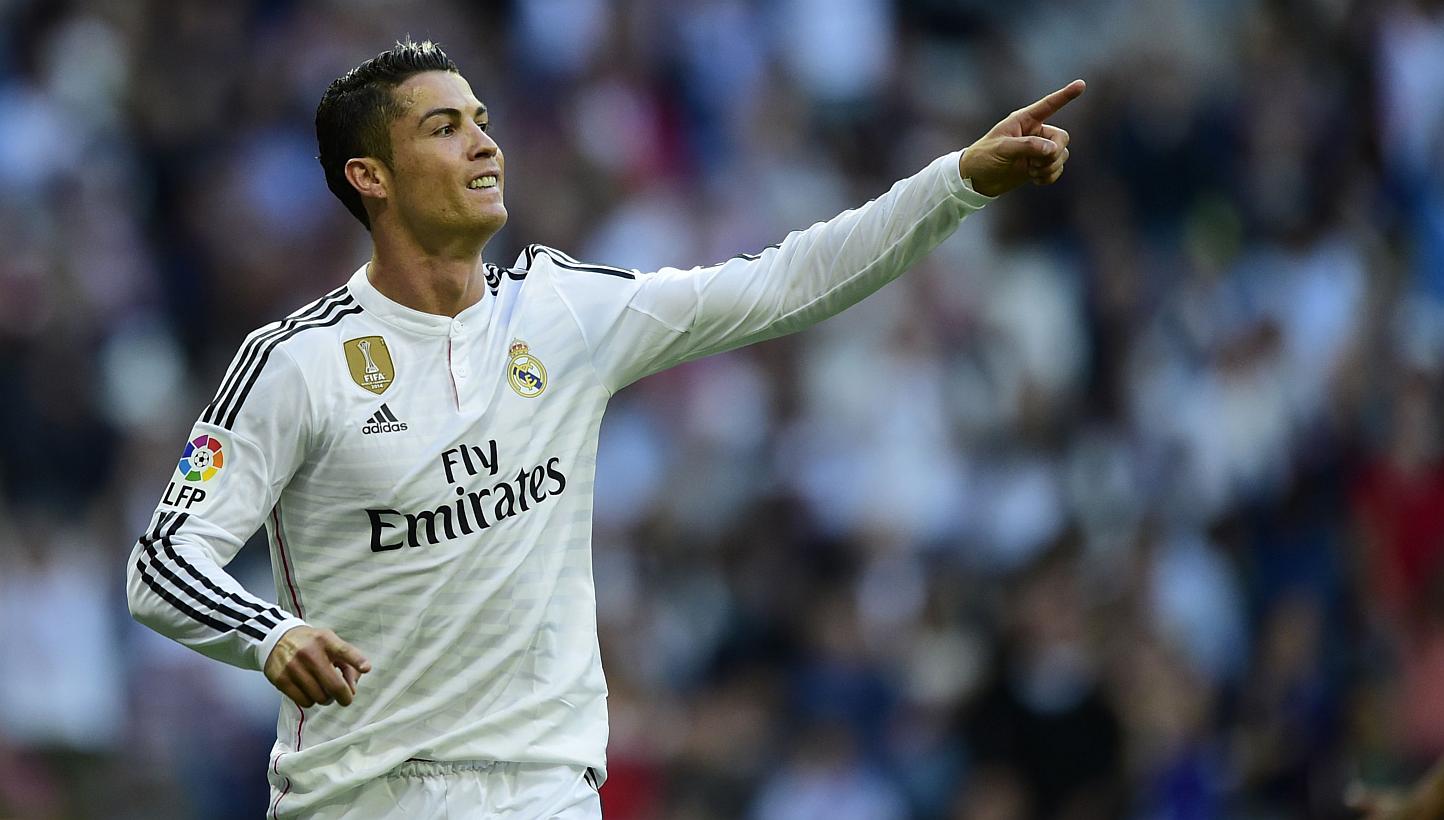 Real Madrid's Portuguese forward Cristiano Ronaldo celebrates after scoring against Getafe at the Santiago Bernabeu stadium in Madrid on May 23, 2015. Ronaldo remains Europe's and the world's most marketable footballer, according to a study released 