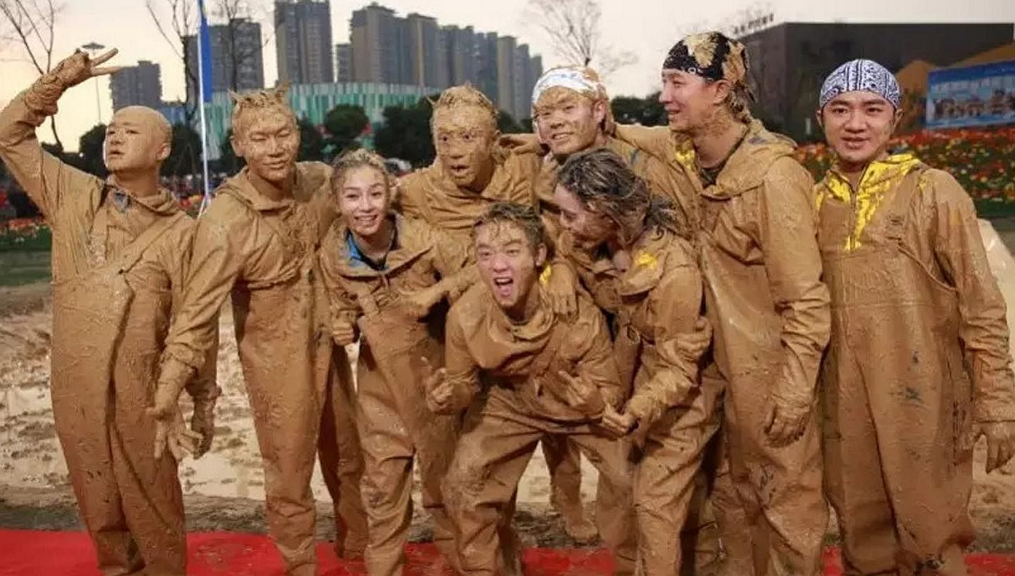 Left: Vicki Zhao (second from left) plays a high-flying marketing executive who takes time off the rat race to get her daughter into a good primary school. Below: Stars caked in mud in the Chinese Running Man.