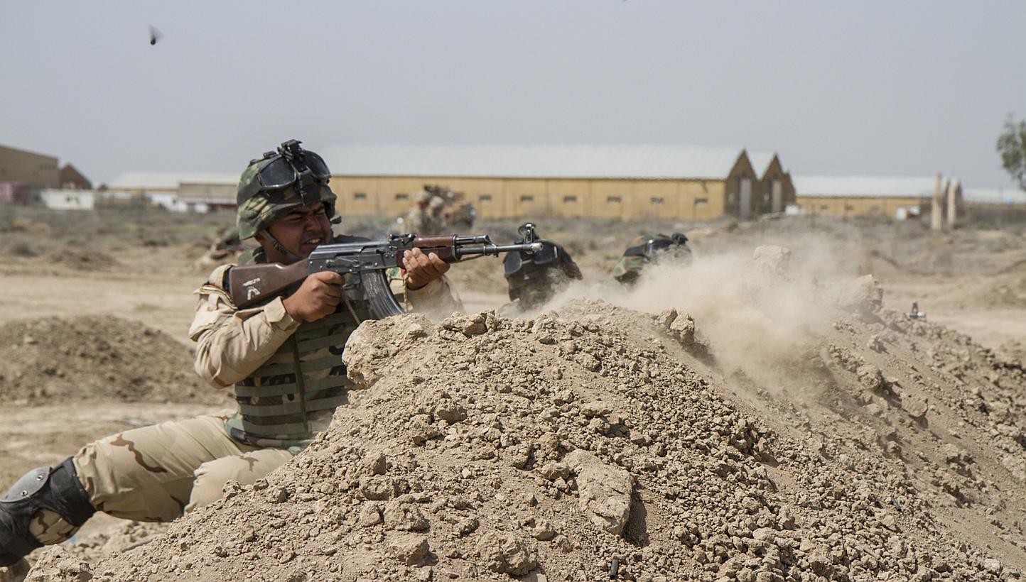 Iraqi soldiers train with members of the US Army 3rd Brigade Combat Team, 82nd Airborne Division, at Camp Taji, Iraq, on June 2, 2015.&nbsp;US President Barack Obama on Wednesday, June 10, approved the deployment of up to 450 more US military personn