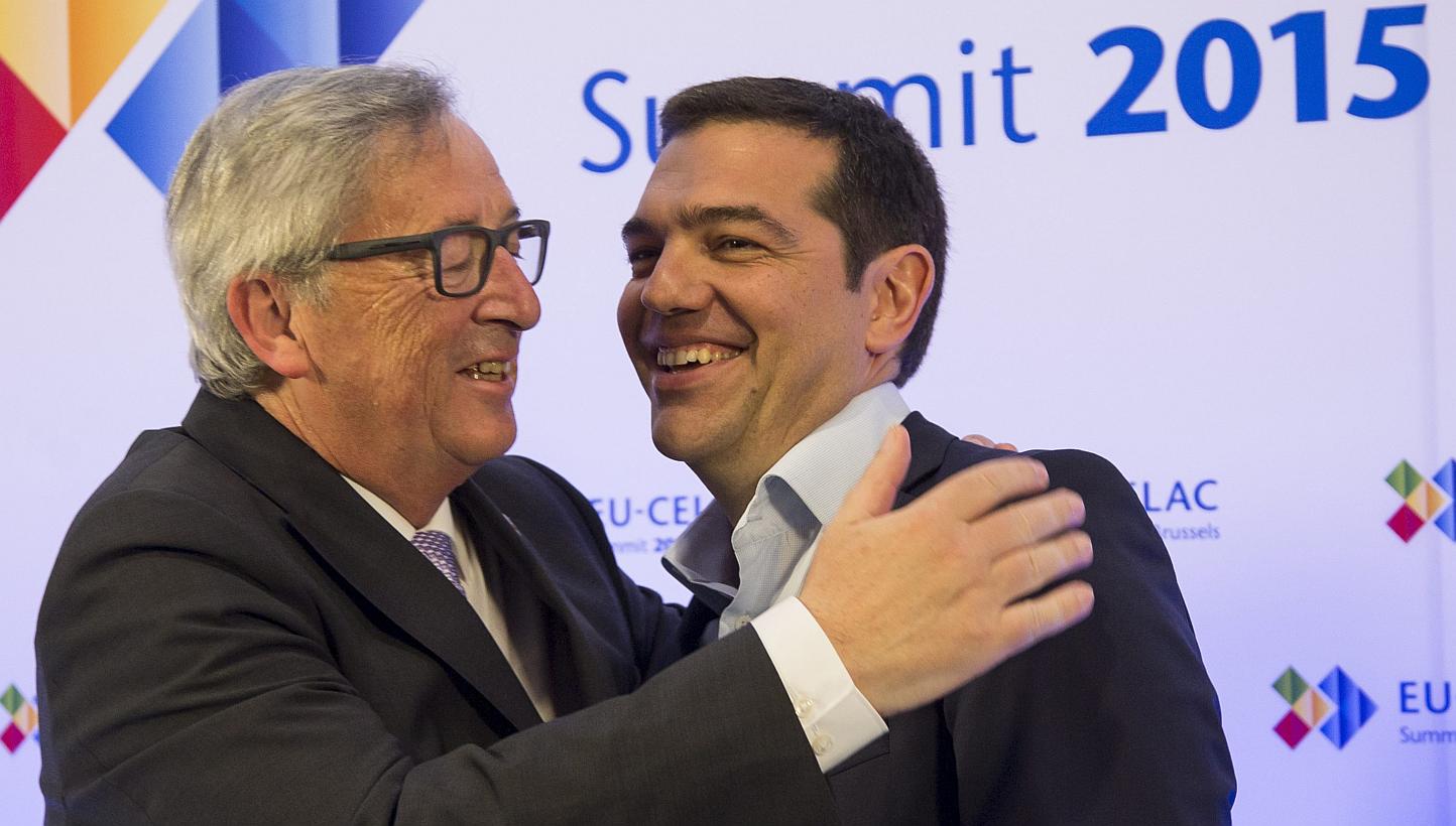 European Commission President Jean-Claude Juncker (left) welcomes Greece's Prime Minister Alexis Tsipras at the start of the European Union and Community of Latin American and Caribbean States (CELAC) summit in Brussels, Belgium, on June 10, 2015. Gr