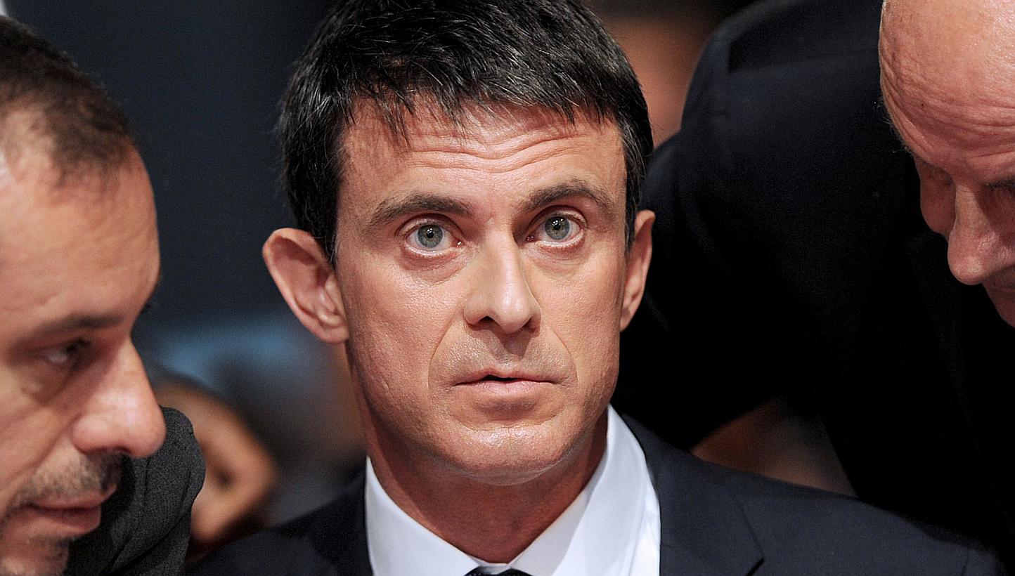 France's prime minister Mr Manual Valls has come under intense pressure after it emerged he used a government jet to transport himself and his two sons to Berlin on Saturday for the final between Barcelona and Juventus. -- PHOTO: AFP 