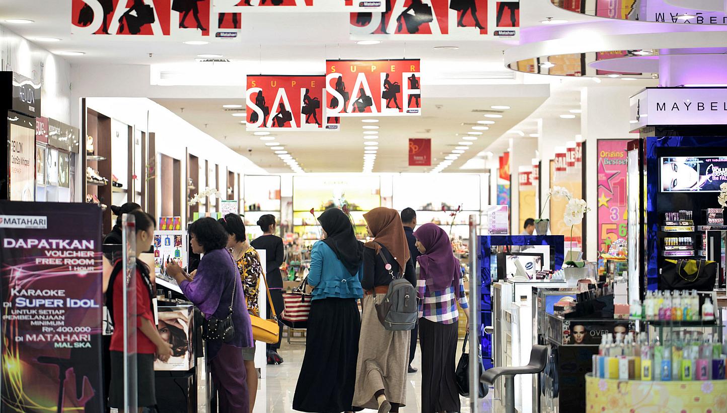 Customers browse inside the Mal Ska shopping mall in Pekanbaru, Riau province, Indonesia. The country is exempting most goods from a luxury tax in a bid to boost household consumption and revive faltering economic growth, says Jakarta's finance minis