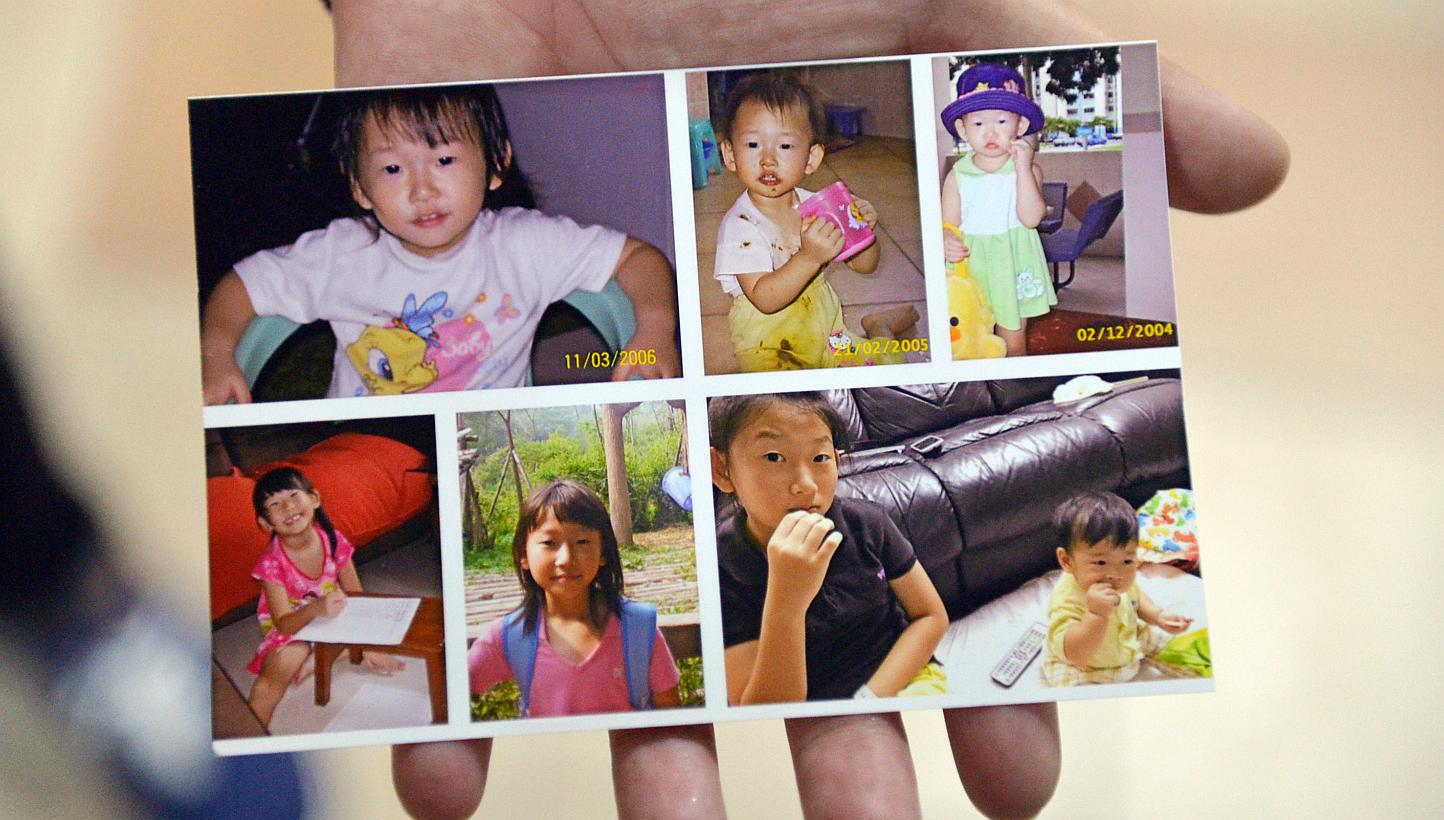 Peony Wee Ying Ping's father showing a photo montage of Peony. Around 100 friends and relatives attended the cremation of the 12-year-old earthquake victim on Thursday. -- ST PHOTO: ALPHONSUS CHERN