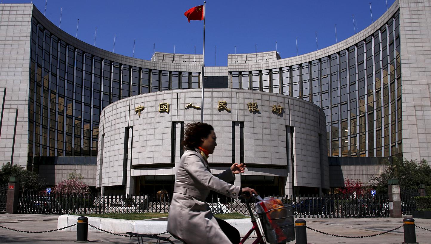 The People's Bank of China may lower the amount lenders must set aside as reserves by as much as 100 basis points this weekend to 17.5 per cent, making it the third reduction this year. -- PHOTO: REUTERS &nbsp;