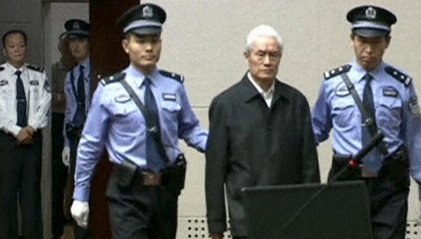 China's former domestic security chief Zhou Yongkang being escorted into court for his sentencing in Tianjin, China, in this still image taken from video provided by China Central Television and shot on June 11, 2015. -- PHOTO: REUTERS