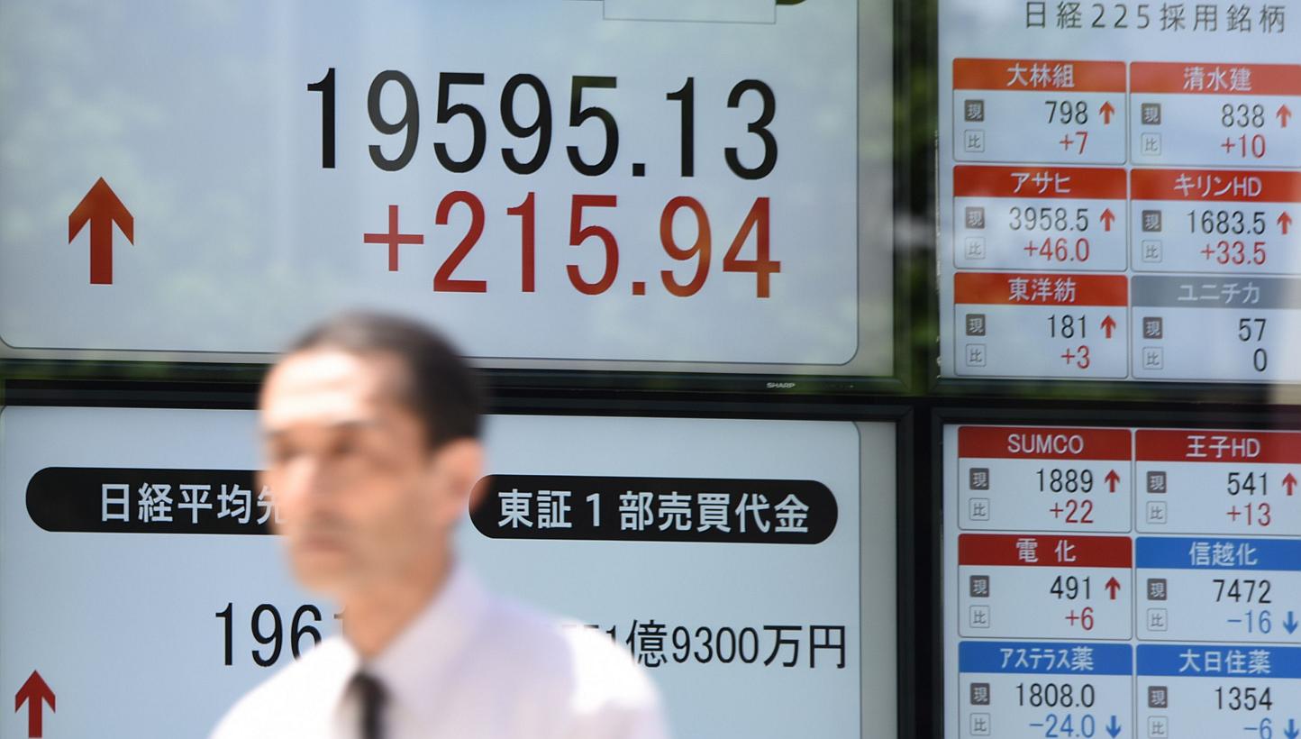Asian stocks rose for a third day after data on retail sales bolstered confidence in the strength of the United States economy and a weaker yen sent Japanese shares higher. -- PHOTO: AFP