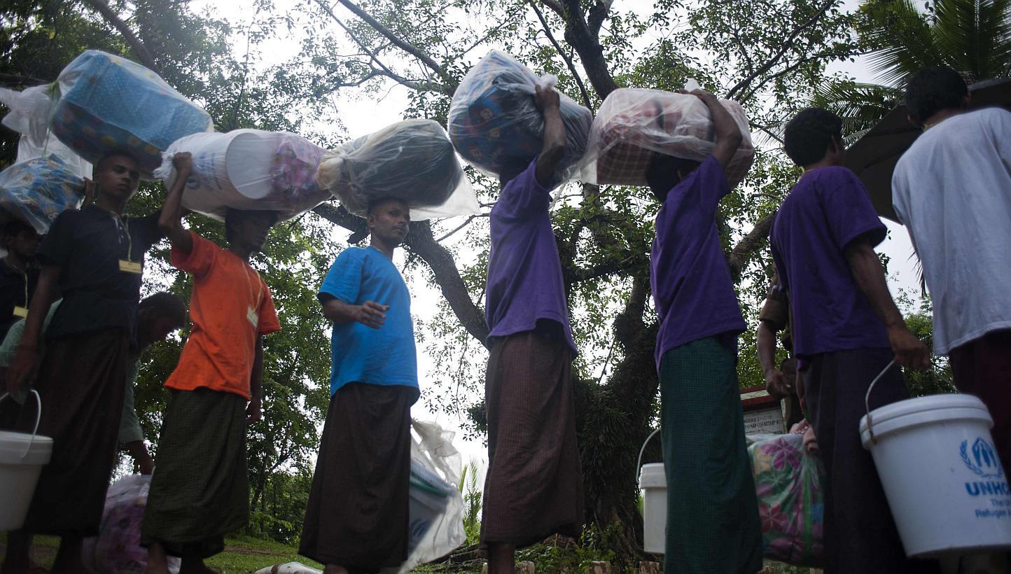 Migrants who were found at sea on a boat waiting to be repatriated across the Myanmar-Bangladesh border in the sub-township of Taung Pyo, Maungdaw, in Myanmar's state of Rakhine on Monday.