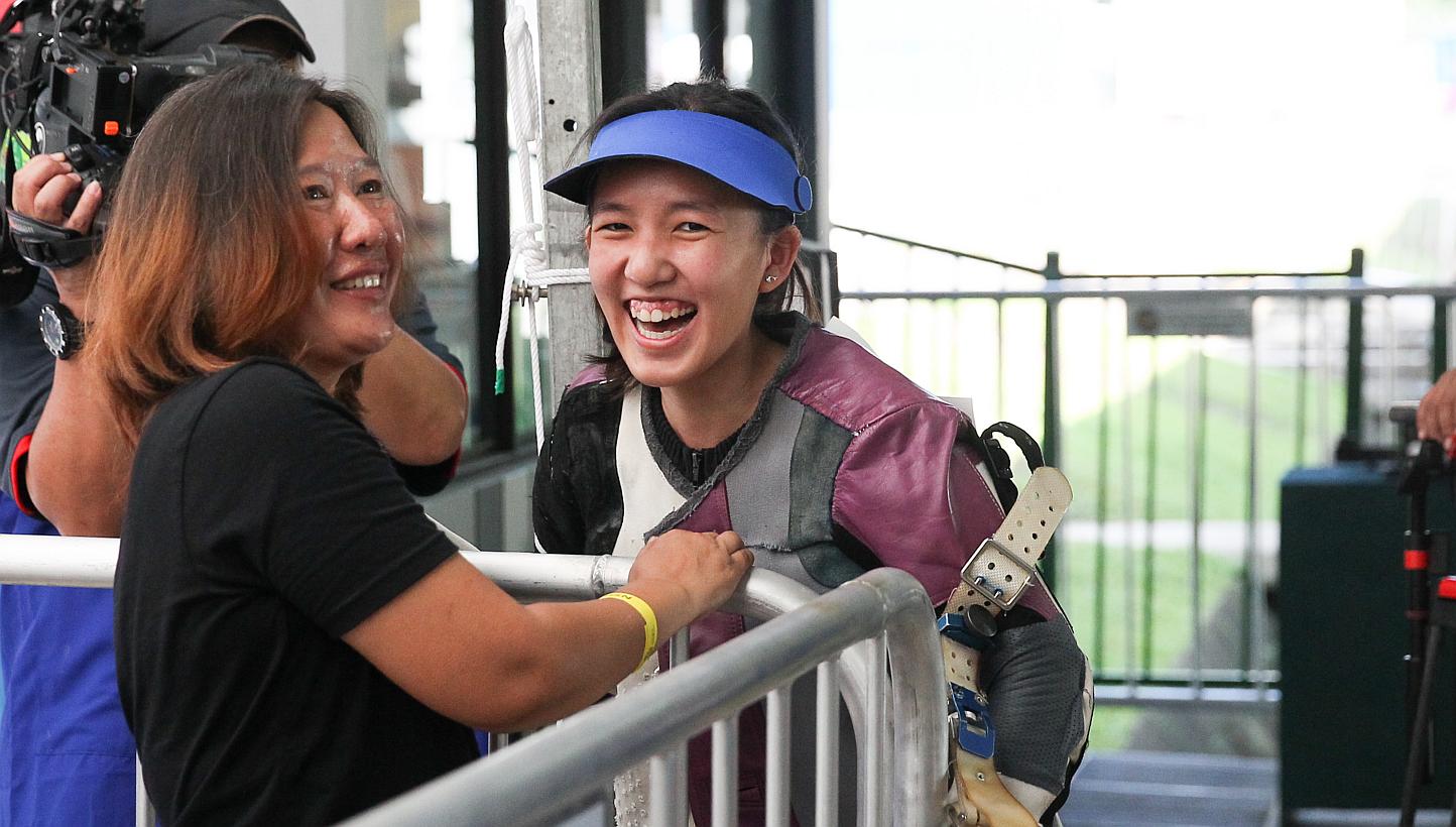 Singapore shooter Jasmine Ser (right) will be aiming to win a gold in the women's 50m rifle three-positions on the final day of the shooting competition on June 12, 2015. -- ST PHOTO: ONG WEE JIN