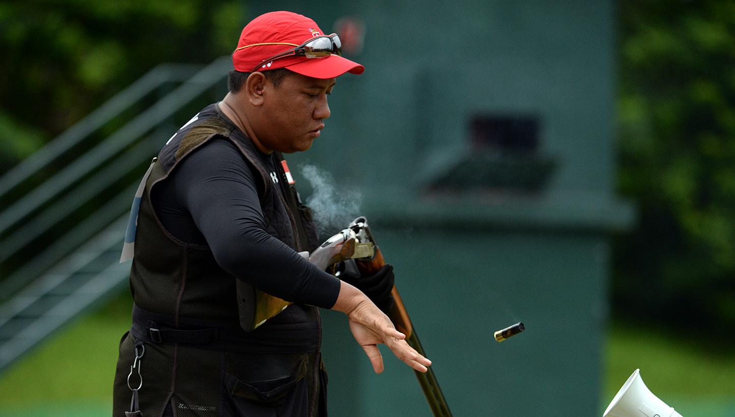 Singapore's Amat Mohd Zain clinched the bronze medal for the men's trap shooting final at the National Shooting Centre on the 12 June 2015. -- ST PHOTO: DESMOND FOO