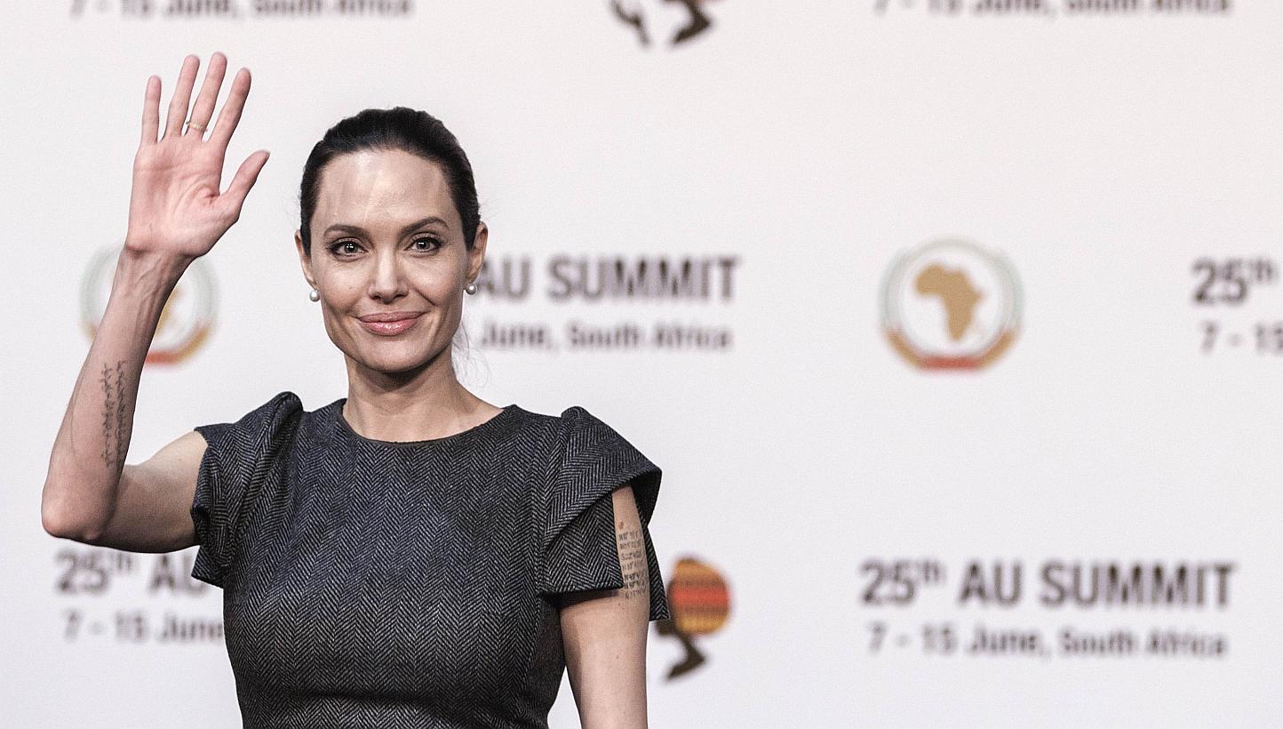 Actress and UNHCR representative Angelina Jolie waves ahead of a panel on conflict-related gender violence on June 12, 2015, during a session of the African Union Summit in Johannesburg, South Africa. -- PHOTO: AFP