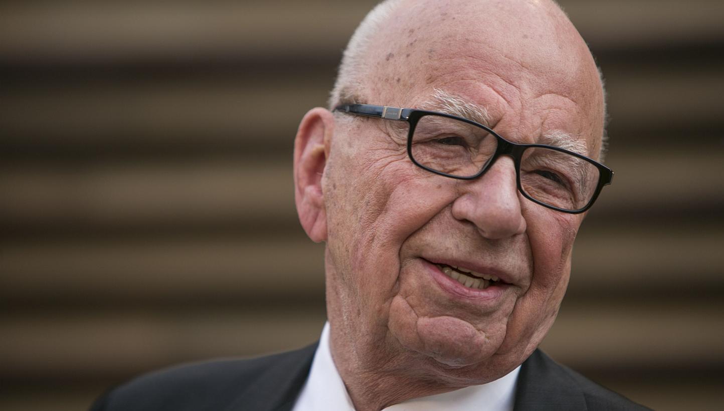 Rupert Murdoch (above, in 2014), who is to step down as chief executive of 21st Century Fox, the media-entertainment conglomerate, still sits at the top of a massive empire. -- PHOTO: AFP