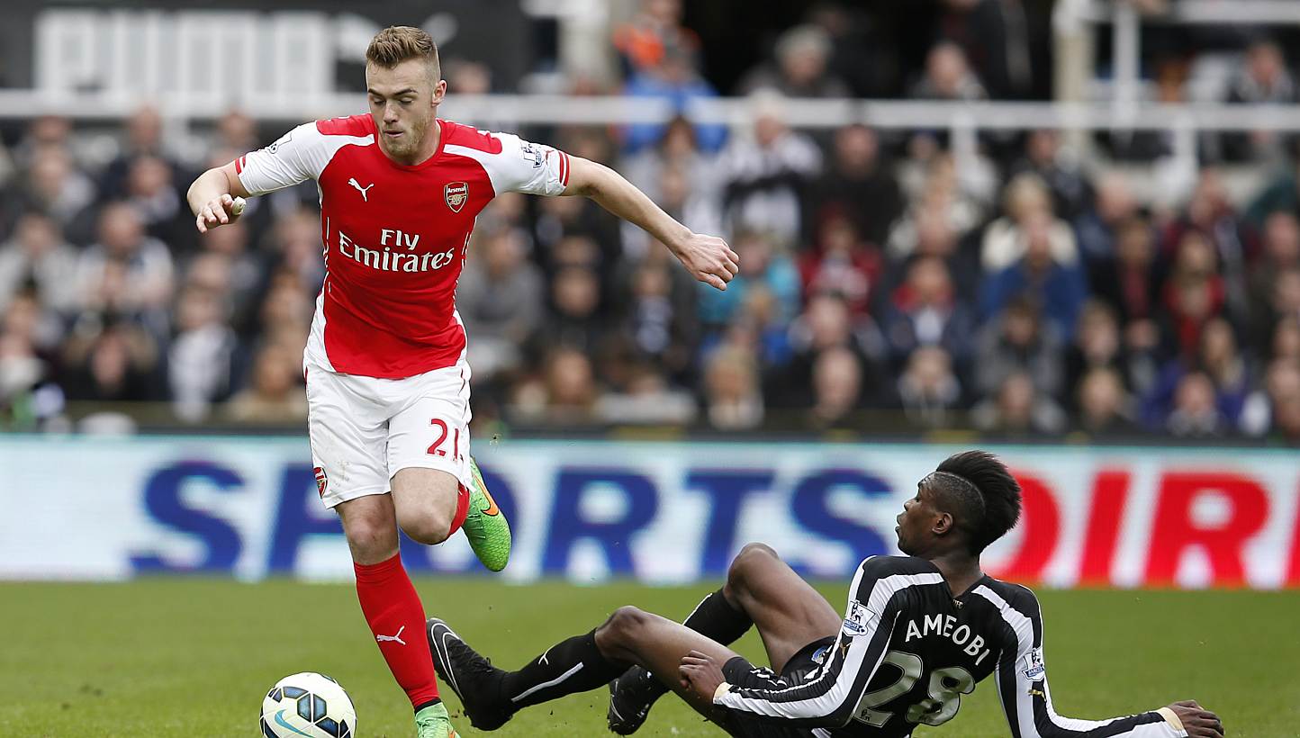 Arsenal have been charged over an alleged breach of regulations relating to its signing of defender Calum Chambers (left) last year. -- PHOTO: REUTERS 