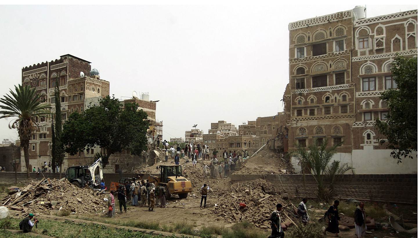 Yemenis search for survivors under the rubble of houses in the UNESCO-listed heritage site in the old city of Yemeni capital Sanaa, on June 12, 2015, following an overnight Saudi-led air strike. -- PHOTO: AFP
